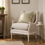 Chester Chair in antique whitewash with curved ashwood frame, woven sides and neutral upholstered cushions, styled in an elegant living room.